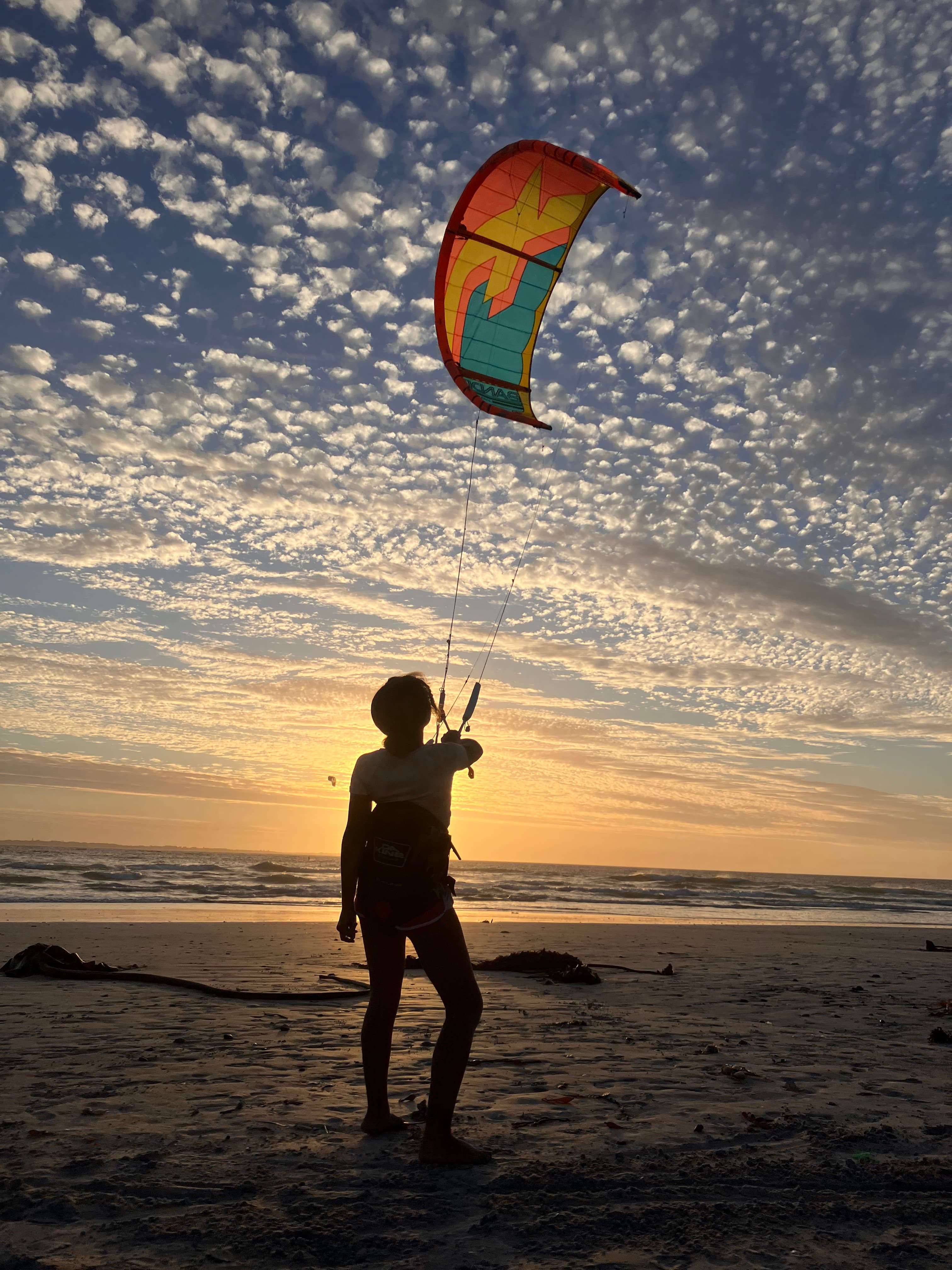 Kitesurfer silhouette at sunset