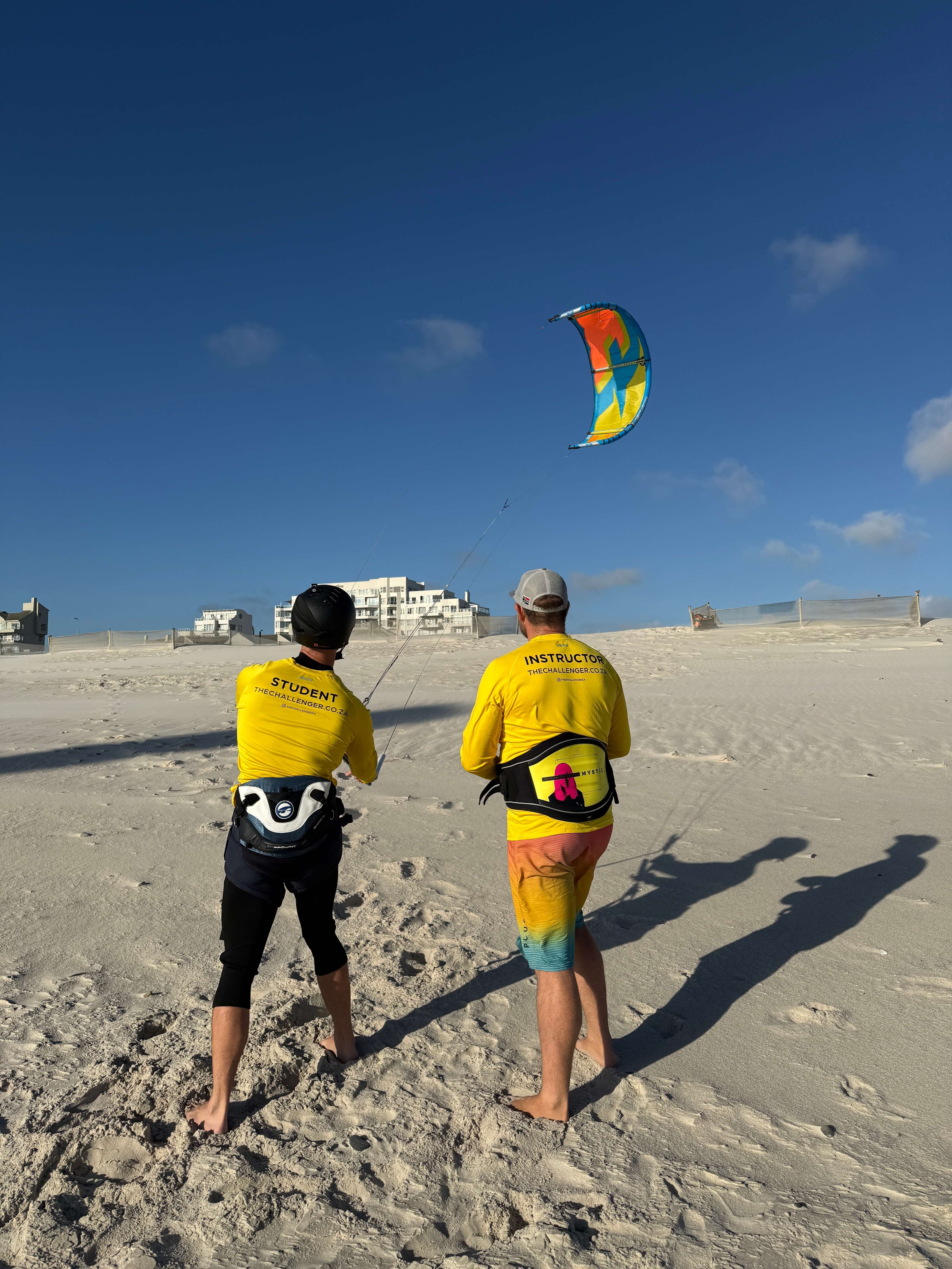 Student practising kite control with instructor guidance