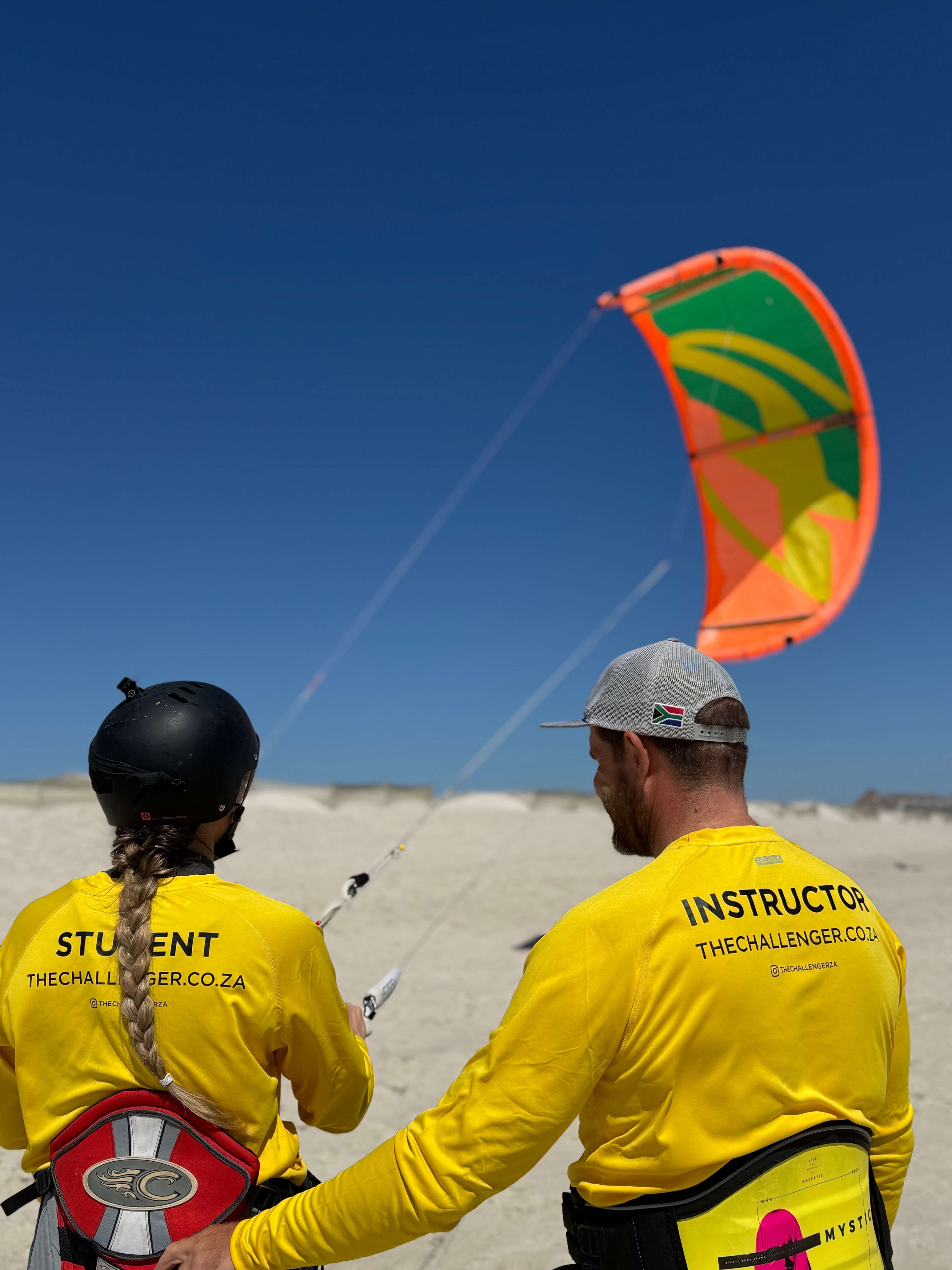 Student and instructor flying kite together
